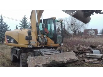 Колёсный экскаватор CATERPILLAR Cat M313D
