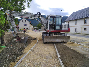 Колёсный экскаватор TAKEUCHI