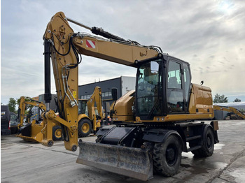 Колёсный экскаватор CATERPILLAR M318