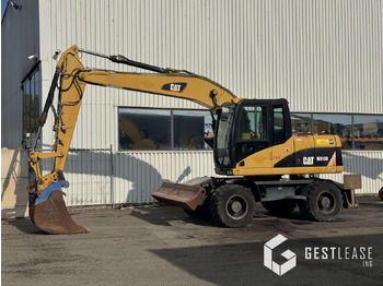 Колёсный экскаватор CATERPILLAR M313D