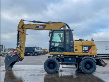 Колёсный экскаватор CATERPILLAR M313D