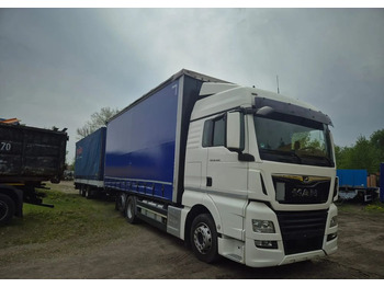 Тентованный грузовик MAN TGX 26.460