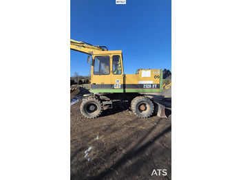 Колёсный экскаватор CATERPILLAR