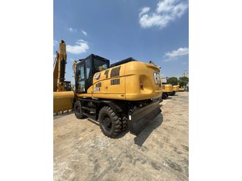 Колёсный экскаватор CATERPILLAR M320