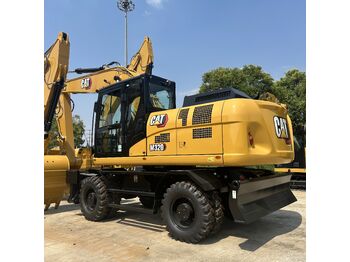 Колёсный экскаватор CATERPILLAR M320