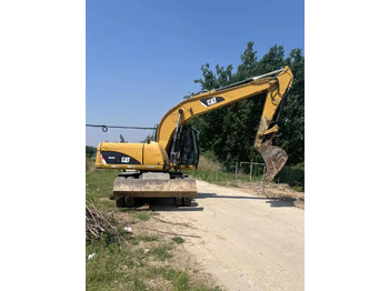 Колёсный экскаватор CATERPILLAR