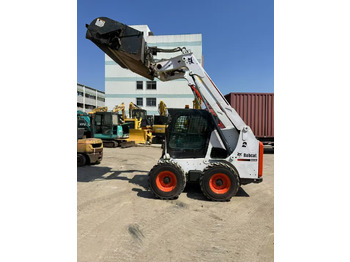 Мини-погрузчик с бортовым поворотом BOBCAT