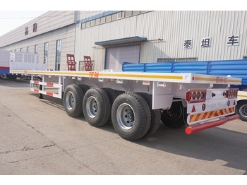 TITAN 3 Axle 40 FT Flatbed Trailer with Front Board лизинг TITAN 3 Axle 40 FT Flatbed Trailer with Front Board: фото 3 TITAN 3 Axle 40 FT Flatbed Trailer with Front Board лизинг TITAN 3 Axle 40 FT Flatbed Trailer with Front Board: фото 3