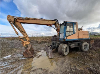 Колёсный экскаватор CATERPILLAR M315