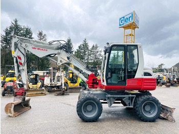 Колёсный экскаватор TAKEUCHI