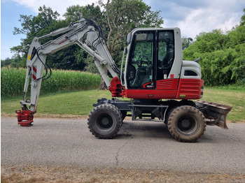 Колёсный экскаватор TAKEUCHI