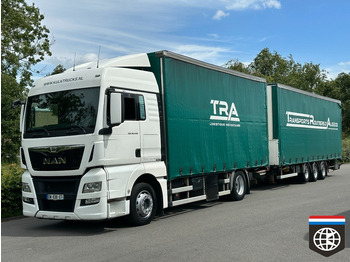 Тентованный грузовик MAN TGX 18.440