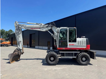 Колёсный экскаватор TAKEUCHI