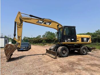 Колёсный экскаватор CATERPILLAR M320