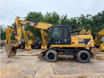 Колёсный экскаватор CATERPILLAR M320