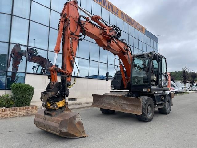 Hitachi ZX140W-5B - Колёсный экскаватор: фото 1 Hitachi ZX140W-5B - Колёсный экскаватор: фото 1