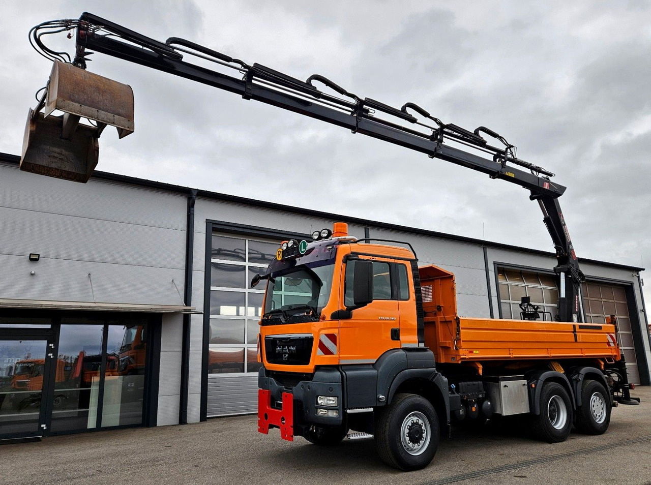MAN TGS 28.360 6x4-4 HIAB 144E-4 Kran Euro5 - Самосвал, Автоманипулятор: фото 1 MAN TGS 28.360 6x4-4 HIAB 144E-4 Kran Euro5 - Самосвал, Автоманипулятор: фото 1