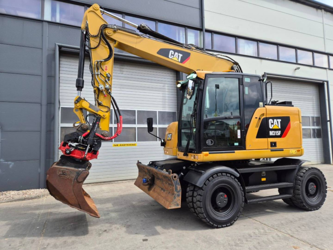 Колёсный экскаватор CAT M315F: фото 1