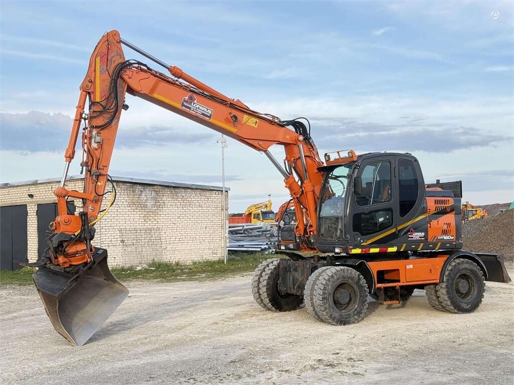 Doosan DX 160 W , ROTO + GRAPPLE - Колёсный экскаватор: фото 1 Doosan DX 160 W , ROTO + GRAPPLE - Колёсный экскаватор: фото 1