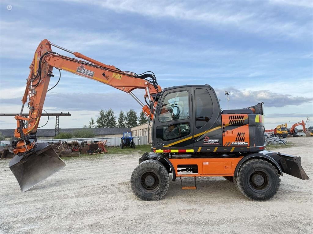 Doosan DX 160 W , ROTO + GRAPPLE - Колёсный экскаватор: фото 2 Doosan DX 160 W , ROTO + GRAPPLE - Колёсный экскаватор: фото 2