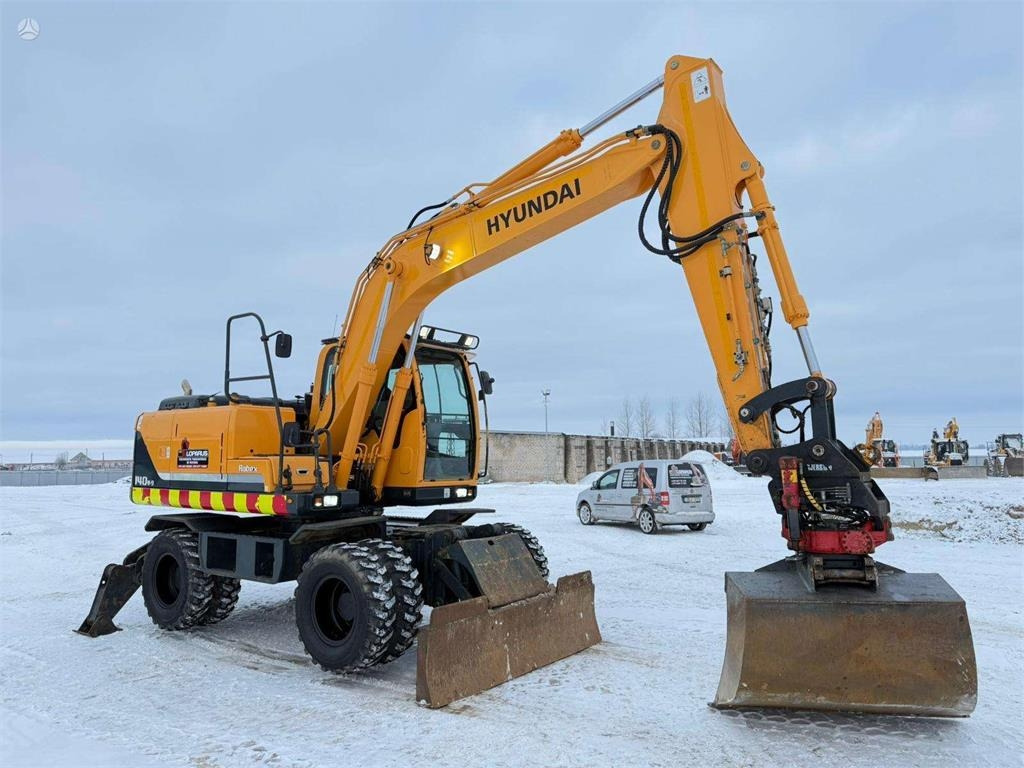 Hyundai Robex 140 W-9 ROTOTILT - Колёсный экскаватор: фото 1 Hyundai Robex 140 W-9 ROTOTILT - Колёсный экскаватор: фото 1