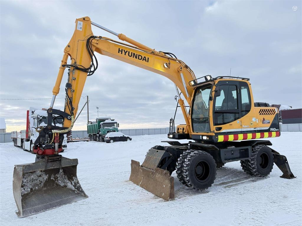 Hyundai Robex 140 W-9 ROTOTILT - Колёсный экскаватор: фото 1 Hyundai Robex 140 W-9 ROTOTILT - Колёсный экскаватор: фото 1