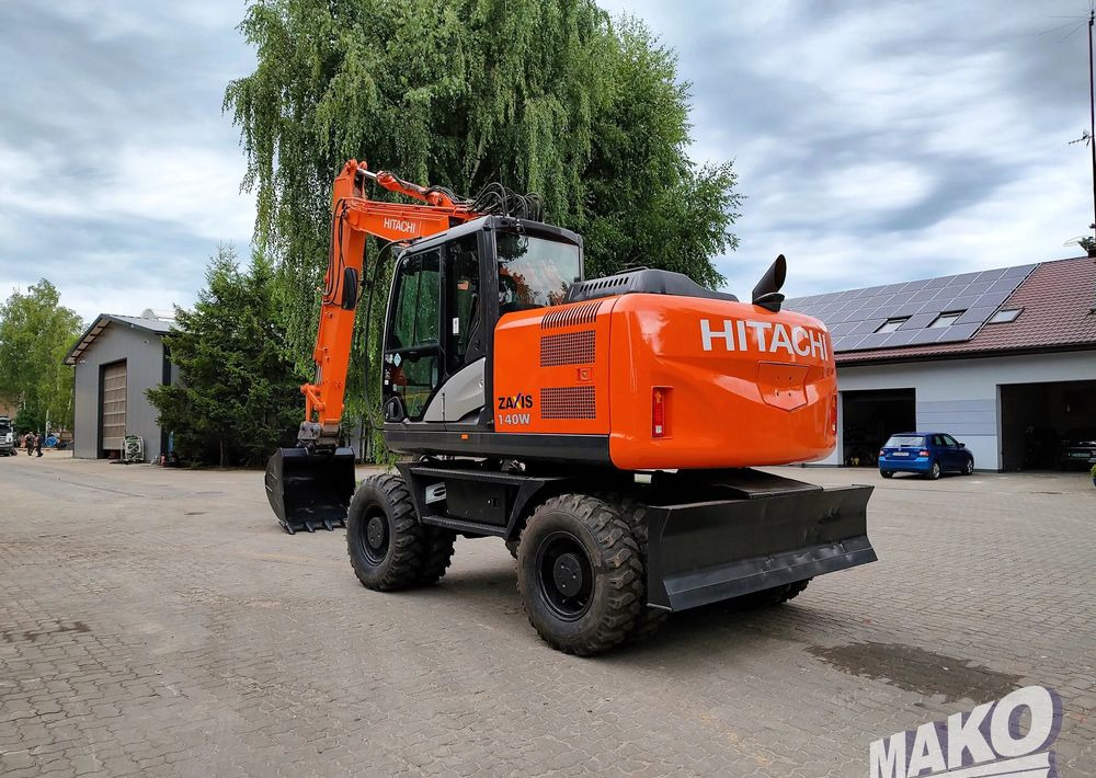 Hitachi ZX 140 - Колёсный экскаватор: фото 2 Hitachi ZX 140 - Колёсный экскаватор: фото 2