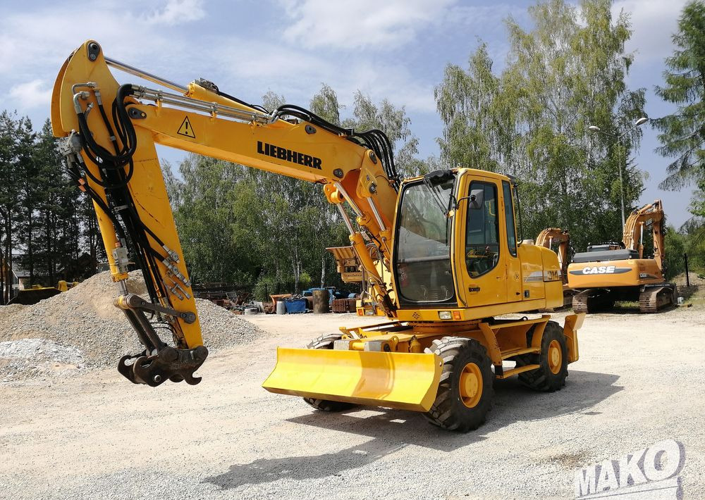 Liebherr A 314 Litronic - Колёсный экскаватор: фото 1 Liebherr A 314 Litronic - Колёсный экскаватор: фото 1