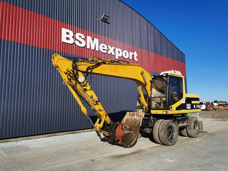 Caterpillar M315 wheel excavator - Колёсный экскаватор: фото 2 Caterpillar M315 wheel excavator - Колёсный экскаватор: фото 2