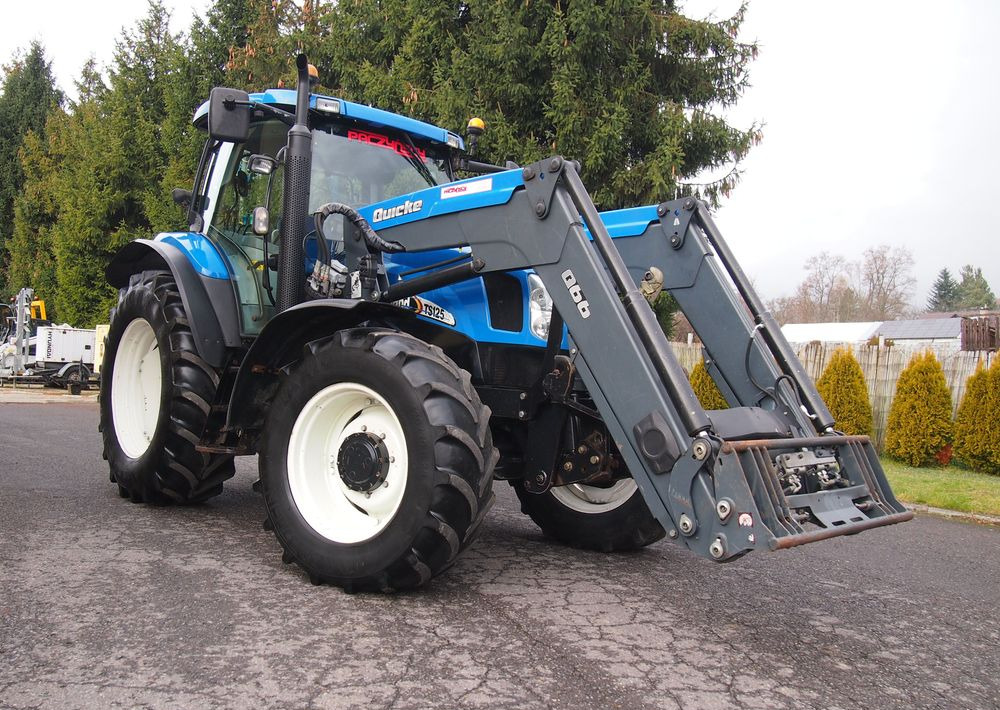 Ciągnik New Holland NH TS125A 6 cylindrów 2004 Ciągnik rolniczy New Holland TS125A - Трактор: фото 2 Ciągnik New Holland NH TS125A 6 cylindrów 2004 Ciągnik rolniczy New Holland TS125A - Трактор: фото 2
