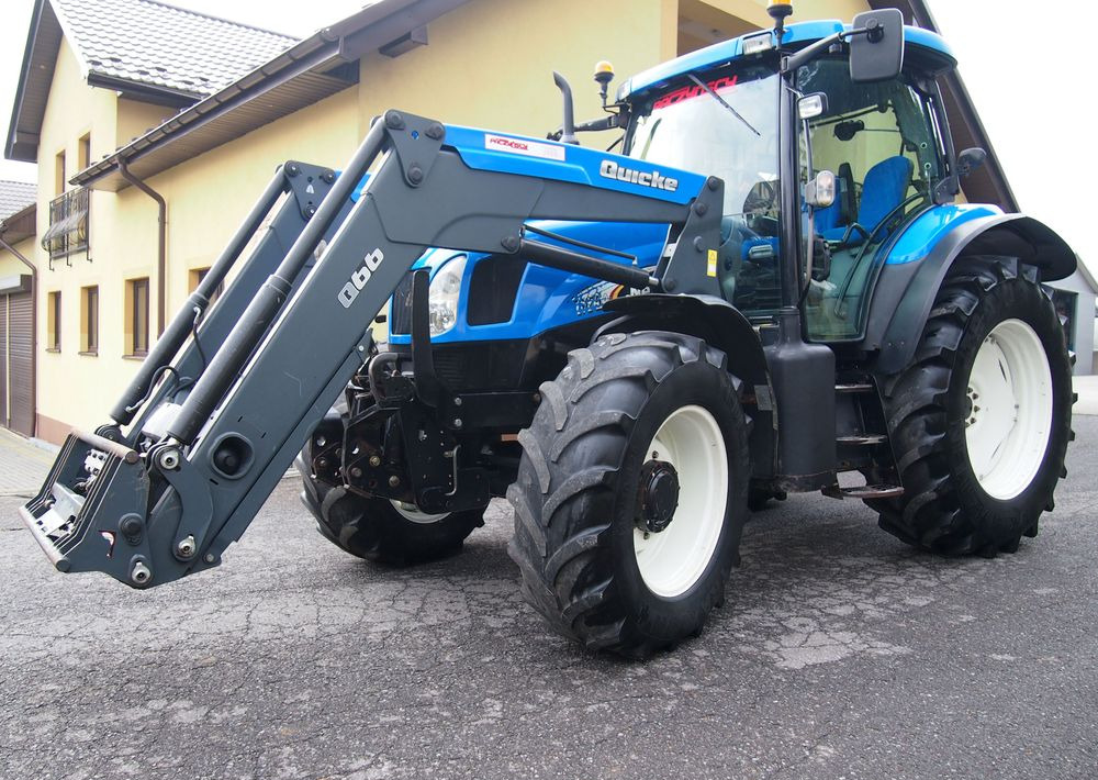Ciągnik New Holland NH TS125A 6 cylindrów 2004 Ciągnik rolniczy New Holland TS125A - Трактор: фото 1 Ciągnik New Holland NH TS125A 6 cylindrów 2004 Ciągnik rolniczy New Holland TS125A - Трактор: фото 1