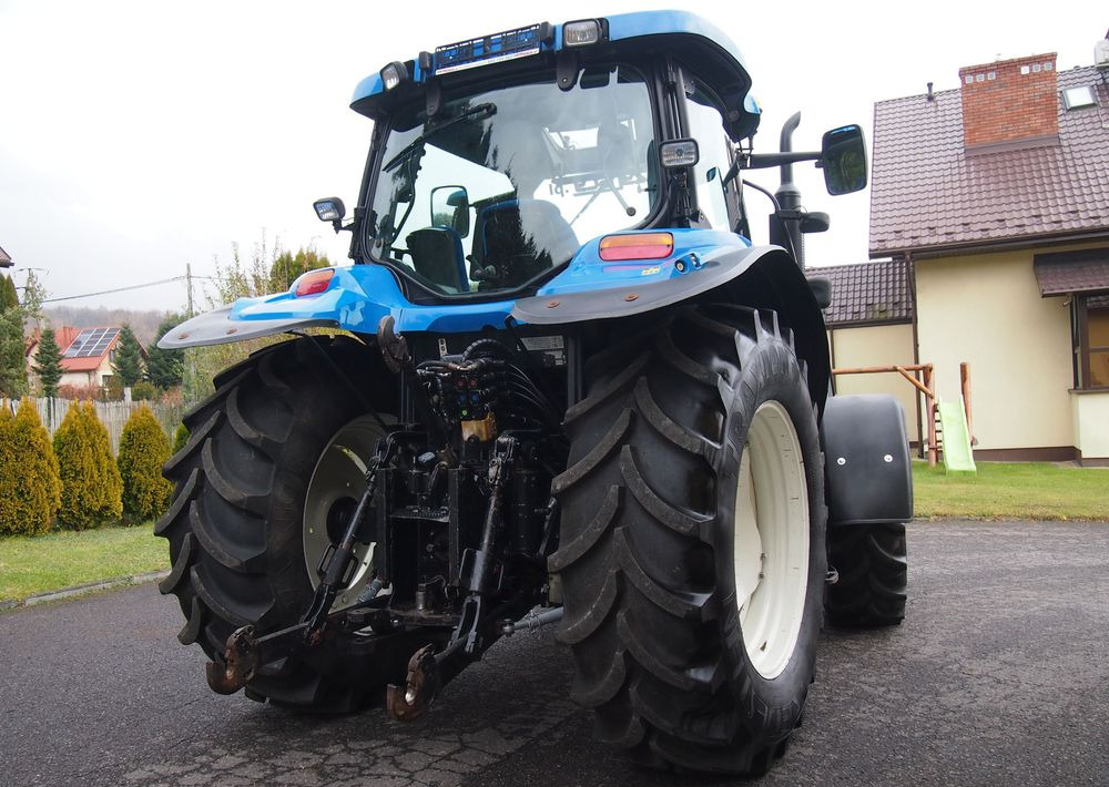 Ciągnik New Holland NH TS125A 6 cylindrów 2004 Ciągnik rolniczy New Holland TS125A - Трактор: фото 5 Ciągnik New Holland NH TS125A 6 cylindrów 2004 Ciągnik rolniczy New Holland TS125A - Трактор: фото 5