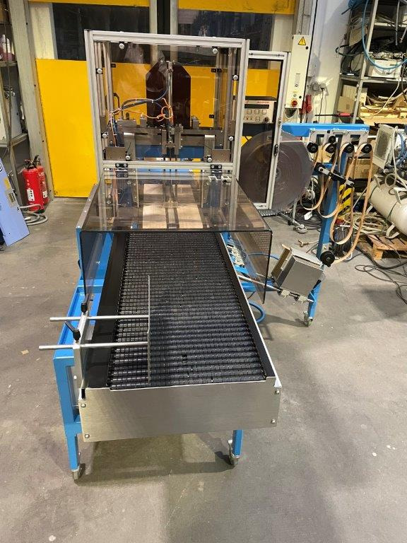 ATS Tanner UltraSonic US 2000-AB transit banding machine with pneumatic product hold-down and infeed roller table - Упаковочное оборудование: фото 4 ATS Tanner UltraSonic US 2000-AB transit banding machine with pneumatic product hold-down and infeed roller table - Упаковочное оборудование: фото 4