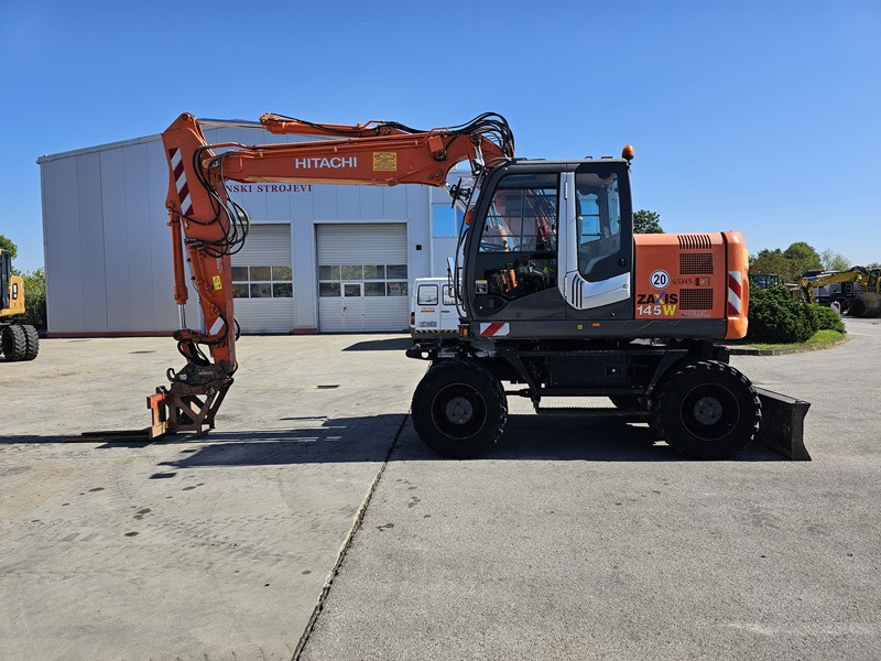HITACHI ZX145W-3 - Колёсный экскаватор: фото 1 HITACHI ZX145W-3 - Колёсный экскаватор: фото 1