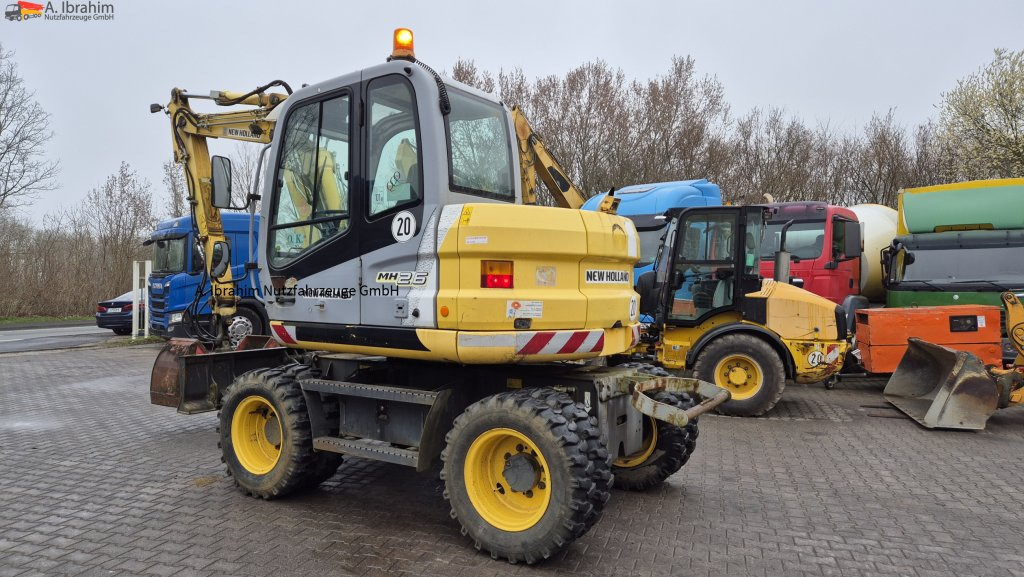 Колёсный экскаватор New Holland MH 2.6 Zustand gut, deutsche Maschine incl. Greifer und Dreservo: фото 10