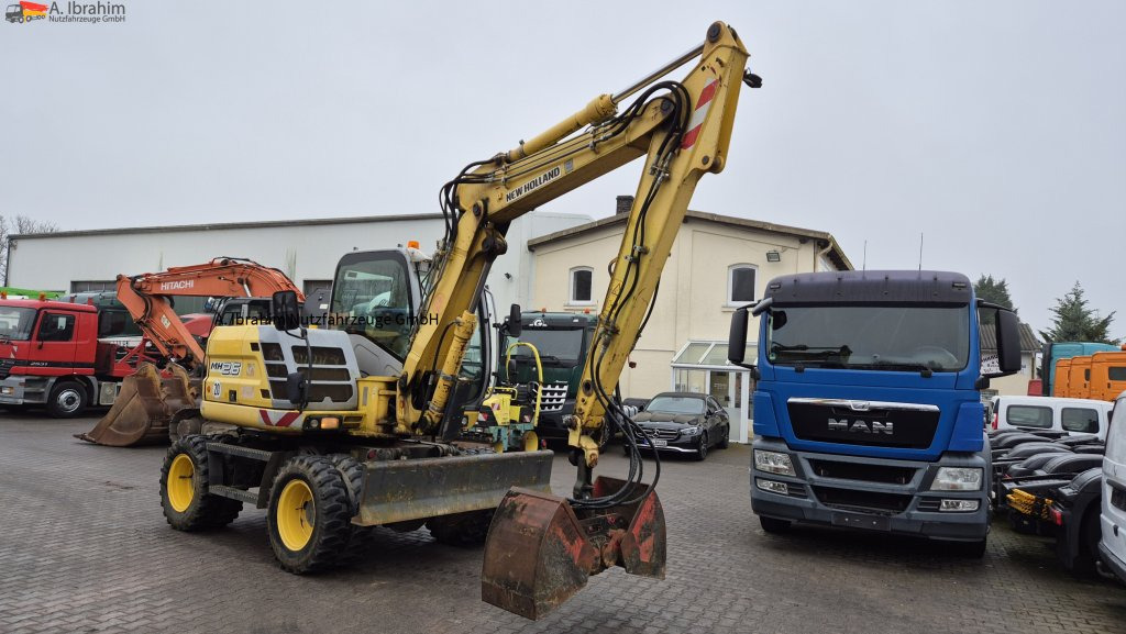Колёсный экскаватор New Holland MH 2.6 Zustand gut, deutsche Maschine incl. Greifer und Dreservo: фото 9