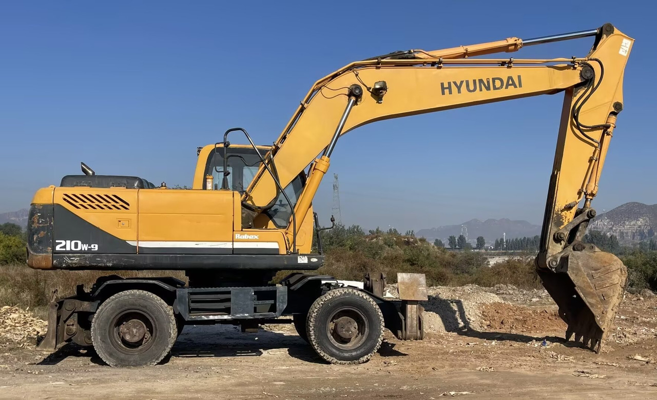HYUNDAI 210W-9 - Колёсный экскаватор: фото 2 HYUNDAI 210W-9 - Колёсный экскаватор: фото 2
