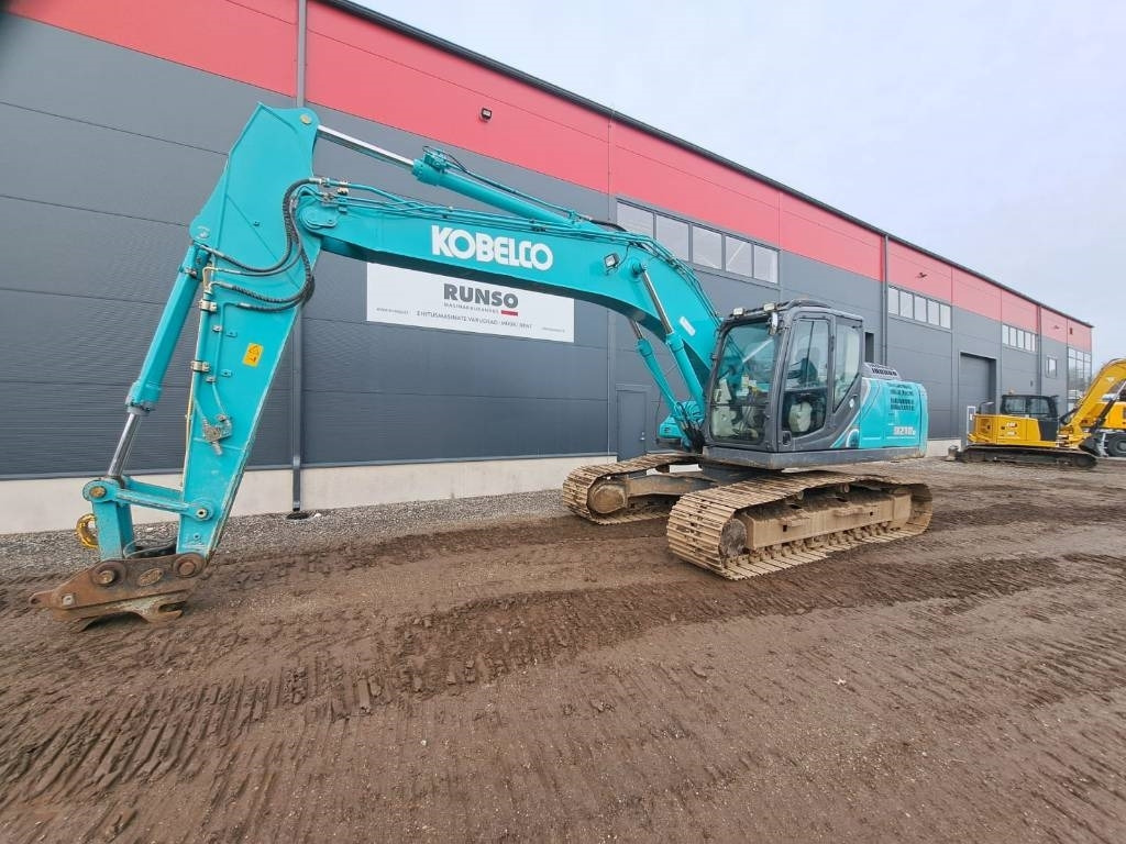 Kobelco SK 210-10 - Гусеничный экскаватор: фото 1 Kobelco SK 210-10 - Гусеничный экскаватор: фото 1