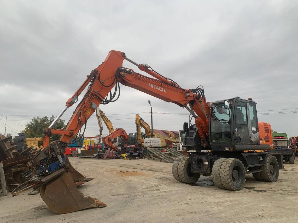 Hitachi ZX 145 W-3+SMP Rototilt - Колёсный экскаватор: фото 1 Hitachi ZX 145 W-3+SMP Rototilt - Колёсный экскаватор: фото 1