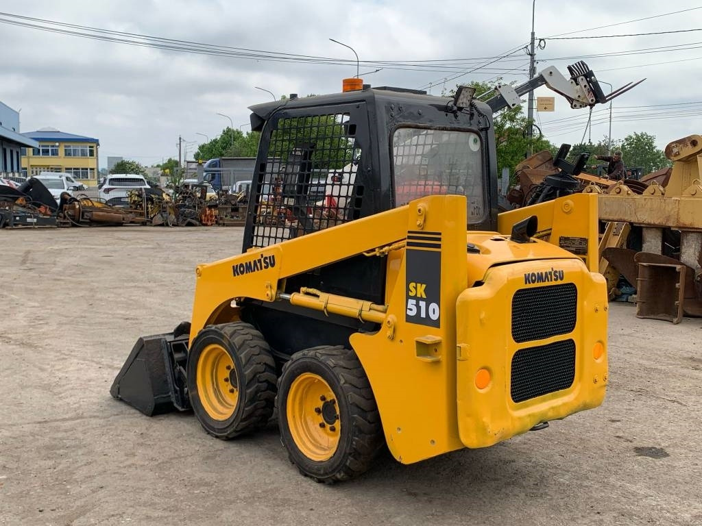 Komatsu SK 510 - Мини-погрузчик с бортовым поворотом: фото 4 Komatsu SK 510 - Мини-погрузчик с бортовым поворотом: фото 4