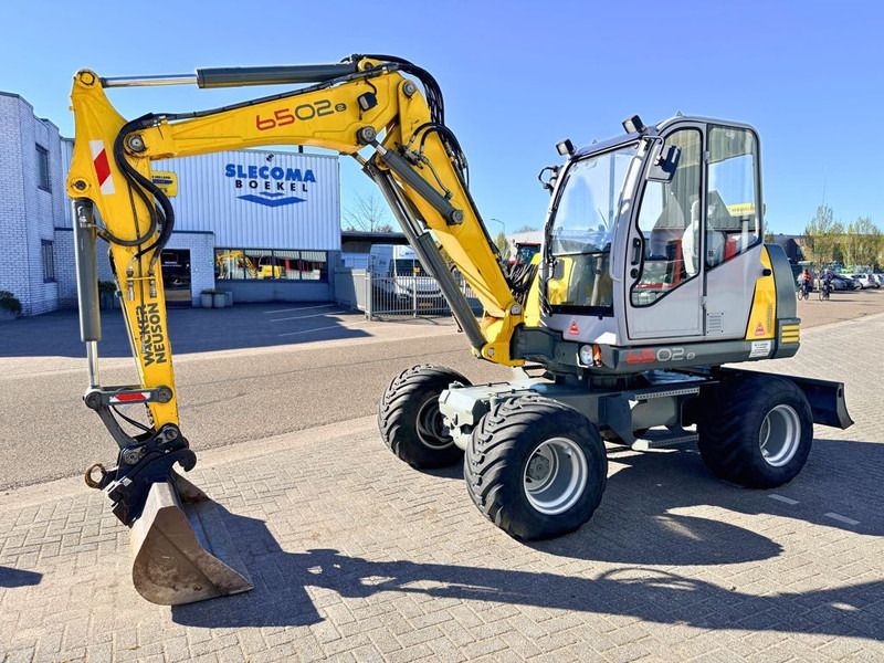 Neuson Wacker Neuson 6502/2 - Колёсный экскаватор: фото 1 Neuson Wacker Neuson 6502/2 - Колёсный экскаватор: фото 1