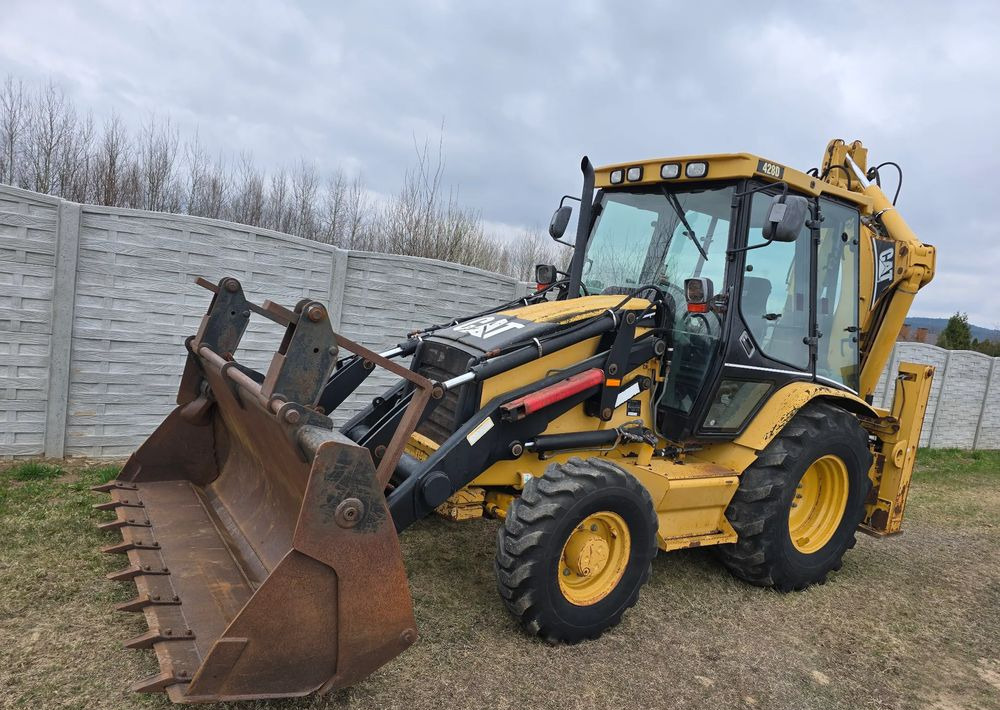 Caterpillar - Экскаватор-погрузчик: фото 1 Caterpillar - Экскаватор-погрузчик: фото 1