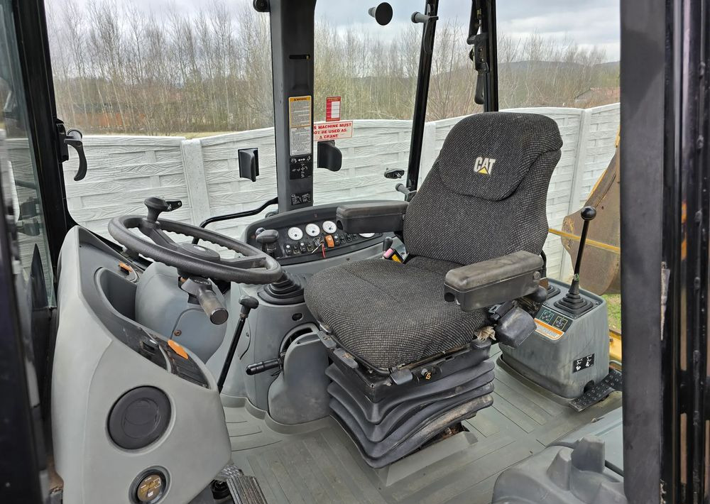 Caterpillar - Экскаватор-погрузчик: фото 2 Caterpillar - Экскаватор-погрузчик: фото 2