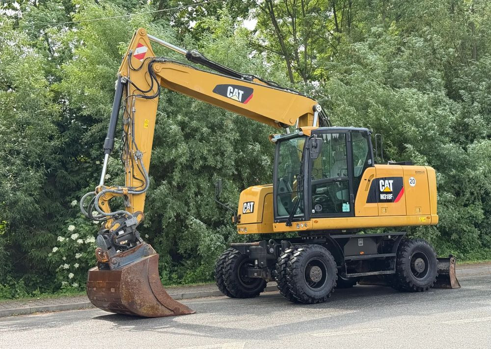 Caterpillar CAT 318 F * Powertilt * Sprowadzony* 9700 MTG * Caterpillar * Stan Perfekcyjny - Колёсный экскаватор: фото 1 Caterpillar CAT 318 F * Powertilt * Sprowadzony* 9700 MTG * Caterpillar * Stan Perfekcyjny - Колёсный экскаватор: фото 1
