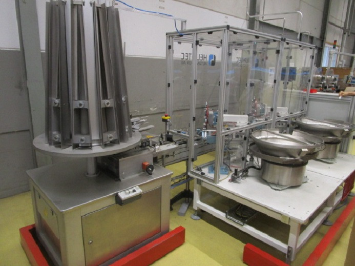 DECKEL ETIKETTIER ANLAGE SCHLEUTER GU 2 DO MIT 2xLÖFFELEINLEGESTATIONEN - Упаковочное оборудование: фото 1 DECKEL ETIKETTIER ANLAGE SCHLEUTER GU 2 DO MIT 2xLÖFFELEINLEGESTATIONEN - Упаковочное оборудование: фото 1