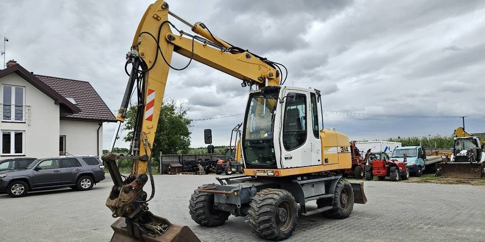 Koparka kołowa Liebherr A314 Litronic 9350 h 4 łyżki kołówka - Колёсный экскаватор: фото 2 Koparka kołowa Liebherr A314 Litronic 9350 h 4 łyżki kołówka - Колёсный экскаватор: фото 2