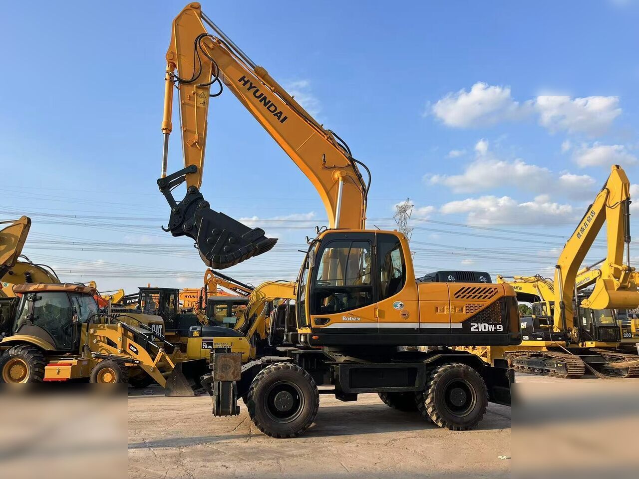 HYUNDAI ROBEX 210W-9 - Колёсный экскаватор: фото 1 HYUNDAI ROBEX 210W-9 - Колёсный экскаватор: фото 1