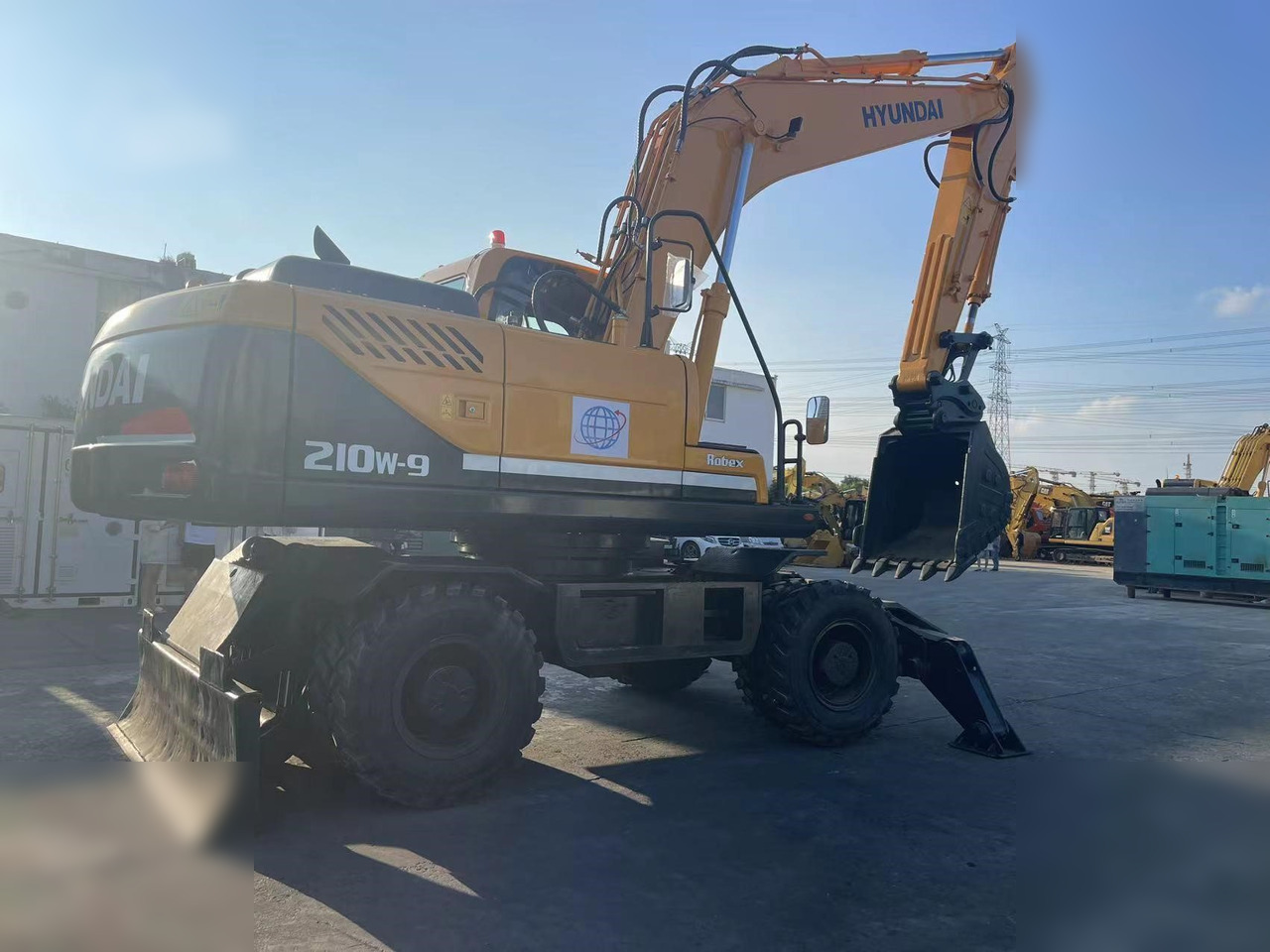 HYUNDAI ROBEX 210W-9 - Колёсный экскаватор: фото 2 HYUNDAI ROBEX 210W-9 - Колёсный экскаватор: фото 2