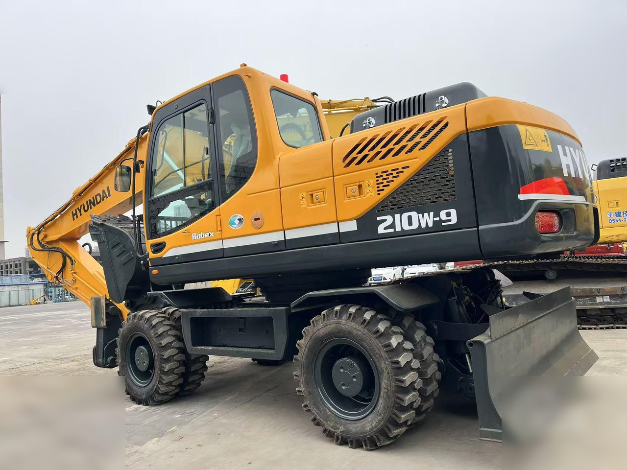 HYUNDAI ROBEX 210W-9S - Колёсный экскаватор: фото 1 HYUNDAI ROBEX 210W-9S - Колёсный экскаватор: фото 1