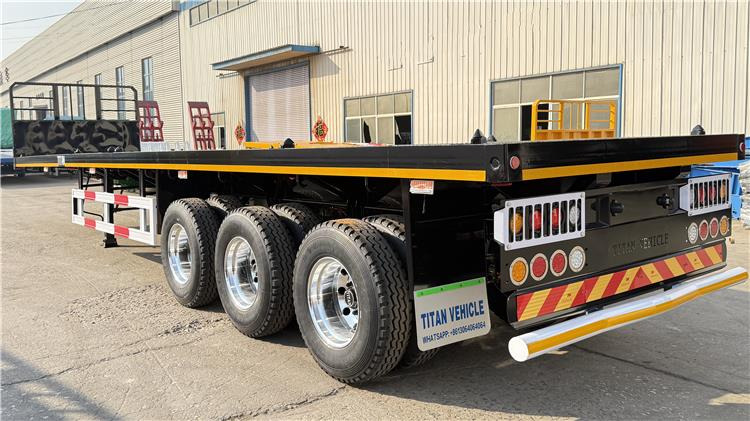 TITAN 12.5M 3 Axle Flat Deck Trailer for Sale In Tanzania - Полуприцеп-контейнеровоз/ Сменный кузов: фото 5 TITAN 12.5M 3 Axle Flat Deck Trailer for Sale In Tanzania - Полуприцеп-контейнеровоз/ Сменный кузов: фото 5